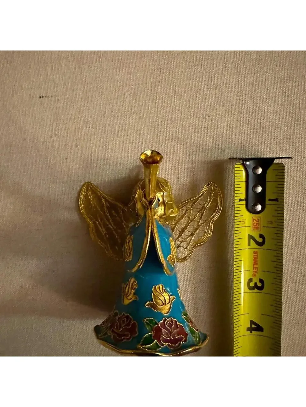 Vintage hand painted and glazed ceramic angel with trumpet 3d details